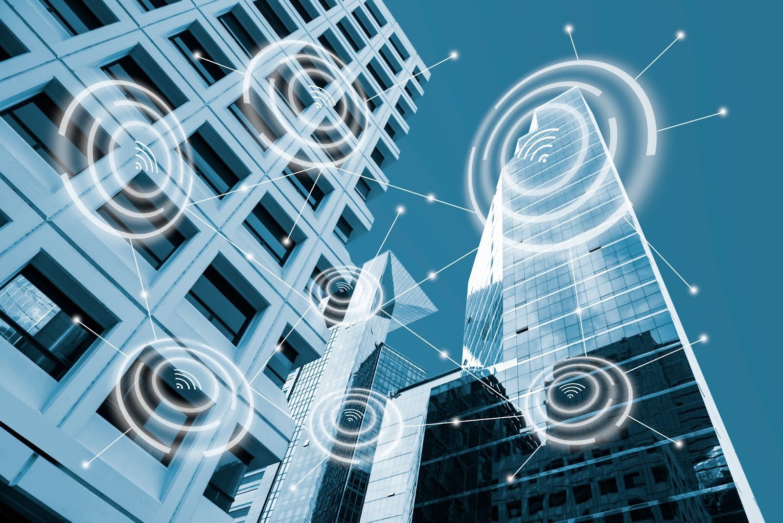 high-rise buildings with wi-fi icons superimposed over them